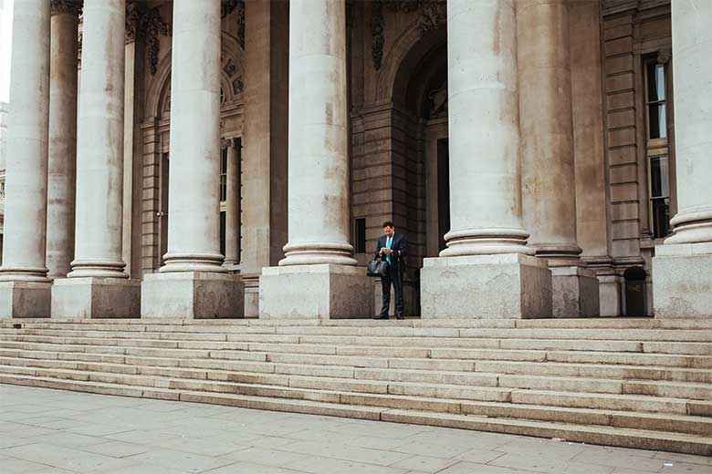 banking and insurance Man outside bank